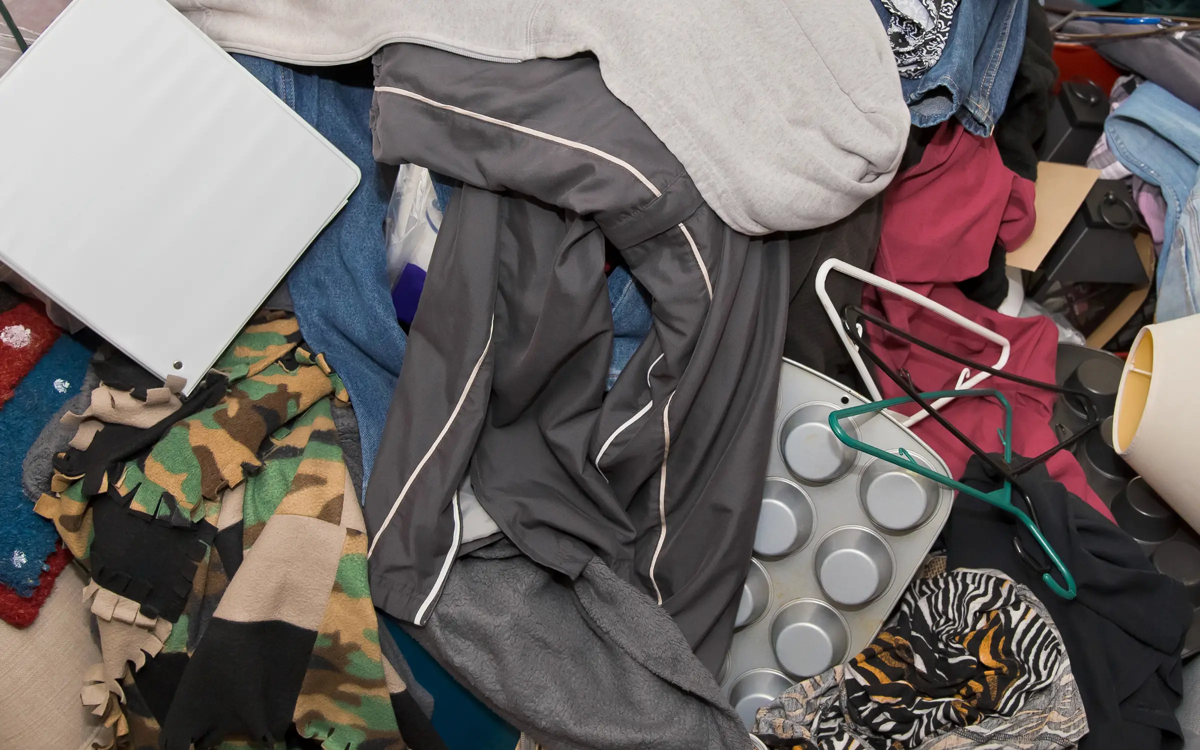 A messy cluttered room, representing hoarding clean up in Maryland
