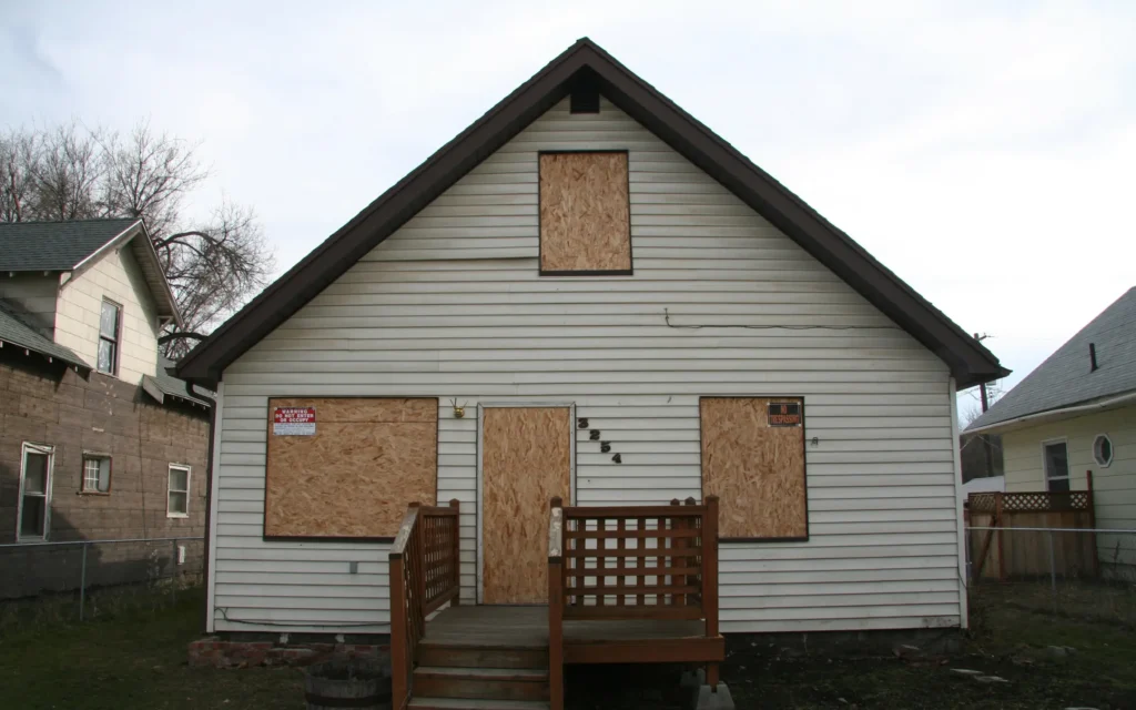 A fully boarded up and secured property in Maryland after fire damage